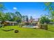 Large yard with pool, wooden shed, firepit, and home featuring solar panels at 528 George Washington Trail, Georgetown, SC 29440
