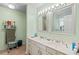Bathroom with double sinks, neutral color palette, and bright lighting at 528 George Washington Trail, Georgetown, SC 29440