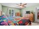 Bedroom featuring wooden furniture, ceiling fan, and view to the pool at 528 George Washington Trail, Georgetown, SC 29440