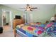 Bedroom with ceiling fan, wood furniture, and closet access at 528 George Washington Trail, Georgetown, SC 29440