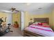 Cozy bedroom with ceiling fan, exercise bike, and comfortable bed at 528 George Washington Trail, Georgetown, SC 29440