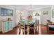 Bright dining room with a wooden table, seating for six, and a charming chandelier at 528 George Washington Trail, Georgetown, SC 29440