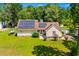 Home with a well-manicured lawn and solar panels for energy efficiency at 528 George Washington Trail, Georgetown, SC 29440