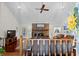 Open living room featuring a brick fireplace, vaulted ceilings, and hardwood floors at 528 George Washington Trail, Georgetown, SC 29440