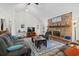 Large living room boasts vaulted ceilings, brick fireplace, and plenty of space to relax at 528 George Washington Trail, Georgetown, SC 29440