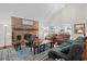 Inviting living room with brick fireplace, vaulted ceilings, and an open layout to dining area at 528 George Washington Trail, Georgetown, SC 29440