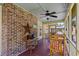 Outdoor screened porch with exposed brick and a tranquil backyard view at 528 George Washington Trail, Georgetown, SC 29440