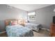 Comfortable bedroom with two twin beds, matching floral linens and a bedside table with lamp at 609 Hillside Dr. S # D-17, North Myrtle Beach, SC 29582