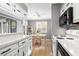 Kitchen view shows white cabinetry, countertops, and breakfast bar with dining area access at 609 Hillside Dr. S # D-17, North Myrtle Beach, SC 29582