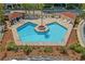 Aerial view of a private pool with chairs and tables on brick-paved patio at 609 Hillside Dr. S # D-17, North Myrtle Beach, SC 29582