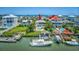 Scenic aerial view of waterfront homes with private docks, pools, and stunning ocean access at 624 Dogwood Dr. S, Garden City Beach, SC 29576