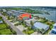 Beautiful aerial view of a home on the water featuring lush landscaping and a boat dock at 624 Dogwood Dr. S, Garden City Beach, SC 29576
