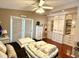 Bedroom with hardwood floors, closet storage, ceiling fan and an abundance of natural light at 624 Dogwood Dr. S, Garden City Beach, SC 29576