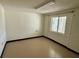 A clean room with a window offering natural light, neutral flooring, and white wainscoting at 624 Dogwood Dr. S, Garden City Beach, SC 29576