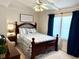 Bedroom featuring a bed, ceiling fan, side table and natural lighting at 624 Dogwood Dr. S, Garden City Beach, SC 29576