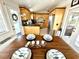 Breakfast nook features a view of the kitchen with its stainless steel appliances and light wood cabinets at 624 Dogwood Dr. S, Garden City Beach, SC 29576