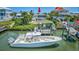 Waterfront home featuring a boat dock, outdoor entertaining space, and inviting backyard pool at 624 Dogwood Dr. S, Garden City Beach, SC 29576