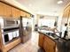 Bright kitchen with stainless steel appliances, light wood cabinets, tile floor and an eat-in breakfast nook with beautiful view at 624 Dogwood Dr. S, Garden City Beach, SC 29576