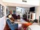 Cozy living room offers lots of natural lighting and comfortable seating, plus open view into bed and dining area at 624 Dogwood Dr. S, Garden City Beach, SC 29576