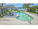 Inviting pool with chairs, a small waterfall, and a nearby pergola overlooking the water at 624 Dogwood Dr. S, Garden City Beach, SC 29576