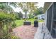 Landscaped backyard featuring a brick patio perfect for outdoor living and entertainment at 654 Blue Bird Ln., Murrells Inlet, SC 29576
