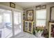 Bright bonus room with floor-to-ceiling windows and various sports memorabilia at 654 Blue Bird Ln., Murrells Inlet, SC 29576