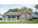 Charming brick home with a cozy front porch and well-maintained lawn at 654 Blue Bird Ln., Murrells Inlet, SC 29576