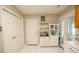Practical mud room with white cabinets and pantry, great for storage at 654 Blue Bird Ln., Murrells Inlet, SC 29576