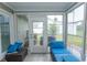 Relaxing sunroom with comfortable lounge seating and an outdoor view at 654 Blue Bird Ln., Murrells Inlet, SC 29576