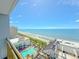 Breathtaking aerial view showcasing the beach, ocean, pool, and surrounding buildings on a bright, sunny day at 7200 N Ocean Blvd. # 1160, Myrtle Beach, SC 29572