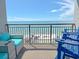 Inviting balcony featuring Adirondack chairs and cushioned seating with stunning ocean vistas at 7200 N Ocean Blvd. # 1160, Myrtle Beach, SC 29572