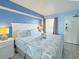 Comfortable bedroom featuring a queen bed with beach-themed decor and bedside tables with lamps at 7200 N Ocean Blvd. # 1160, Myrtle Beach, SC 29572