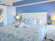 Serene bedroom with a seashell-themed bed, white furniture, and ocean-inspired decor for a relaxing coastal retreat at 7200 N Ocean Blvd. # 1160, Myrtle Beach, SC 29572