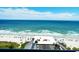 Expansive view of the ocean and beach from a high vantage point, capturing the horizon and beach activity at 7200 N Ocean Blvd. # 1160, Myrtle Beach, SC 29572