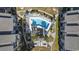 Aerial view showcases a pristine pool and seating arrangement that provides residents with a relaxing and luxurious outdoor experience at 7700 Porcher Dr. # 3207, Myrtle Beach, SC 29572