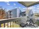 Private balcony with seating and a view of the surrounding complex on a bright, sunny day at 7700 Porcher Dr. # 3207, Myrtle Beach, SC 29572