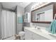 Clean bathroom with vanity, toilet, shower, and coastal-themed decor for a refreshing experience at 7700 Porcher Dr. # 3207, Myrtle Beach, SC 29572