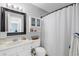 Functional bathroom featuring a vanity, mirror, shower, and storage, providing convenience and style at 7700 Porcher Dr. # 3207, Myrtle Beach, SC 29572