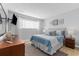 Bright bedroom with a comfortable bed, dresser, and large window, perfect for a restful sleep at 7700 Porcher Dr. # 3207, Myrtle Beach, SC 29572