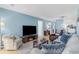 Cozy living room with comfortable seating, light wood floors, and a modern aesthetic at 7700 Porcher Dr. # 3207, Myrtle Beach, SC 29572