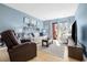 Bright living room with comfortable seating, beach decor, and access to a private balcony at 7700 Porcher Dr. # 3207, Myrtle Beach, SC 29572