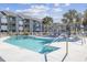 Enjoy a refreshing dip in this community pool, complete with lounge chairs and a gazebo, perfect for relaxation at 7700 Porcher Dr. # 3207, Myrtle Beach, SC 29572