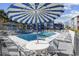 Inviting community pool with comfortable lounge chairs, perfect for relaxation and enjoying the outdoors at 7700 Porcher Dr. # 3207, Myrtle Beach, SC 29572