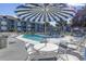 Inviting community pool with comfortable lounge chairs, perfect for relaxation and enjoying the outdoors at 7700 Porcher Dr. # 3207, Myrtle Beach, SC 29572