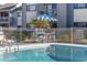 Enjoy the refreshing community pool, surrounded by a fence, palm trees and plenty of seating at 7700 Porcher Dr. # 3207, Myrtle Beach, SC 29572