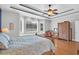 Comfortable bedroom with a bay window, hardwood floors, and neutral tones create a relaxing atmosphere at 8013 Wacobee Dr., Myrtle Beach, SC 29579