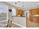 Warm breakfast nook featuring stone countertops and wood cabinets seamlessly connected to the kitchen at 8013 Wacobee Dr., Myrtle Beach, SC 29579