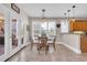Cozy breakfast nook with pendant lighting, windows, and access to the patio at 8013 Wacobee Dr., Myrtle Beach, SC 29579