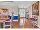 Home foyer featuring a colorful accent wall, wooden furniture, and hardwood flooring at 8013 Wacobee Dr., Myrtle Beach, SC 29579
