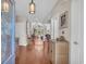 Elegant entryway with hardwood floors leading to a spacious living area filled with natural light at 8013 Wacobee Dr., Myrtle Beach, SC 29579